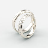 Vielsesringe i hvidguld med bølgeslebne og graduerede diamanter – EG09