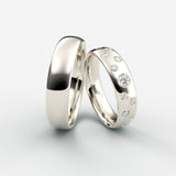 Vielsesringe i hvidguld med ujævnt placerede diamanter i et stjernemønster – EG17