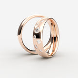 Rosaguld vielsesringe med ujævnt placerede diamanter i et stjernemønster – EG17