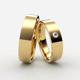 vielsesringe i guld med flad profil og indfattet diamant – EG30