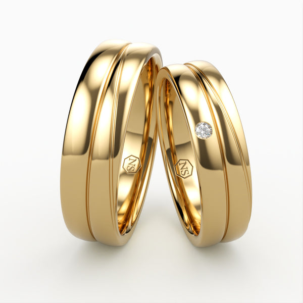 Klassiske Vielsesringe i Guld med Enkelt Diamant Detalje