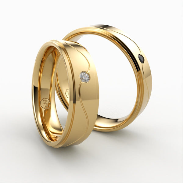 Guld vielsesringe med bølget design og sorte og hvide diamanter – EG42 - side